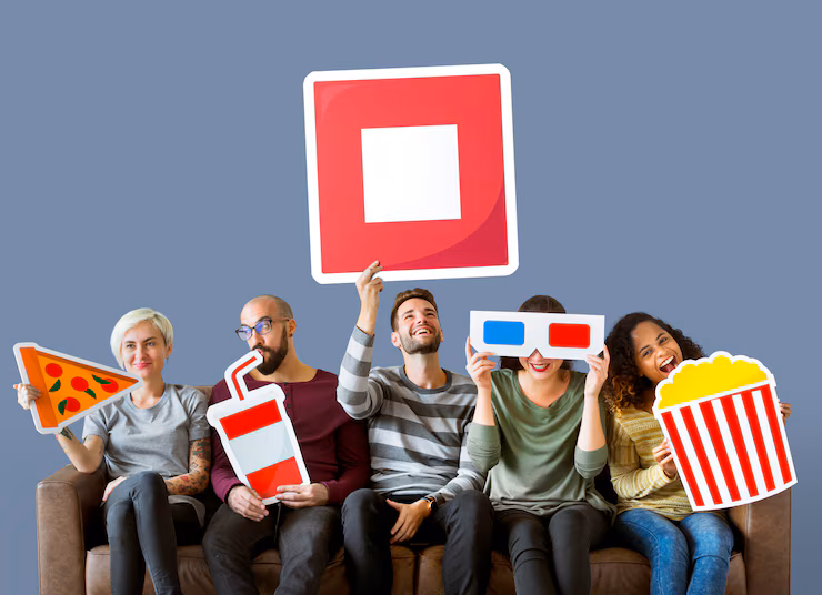 Group of diverse friends holding movie emoticons